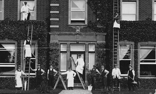 Workmen around front door of Redfield